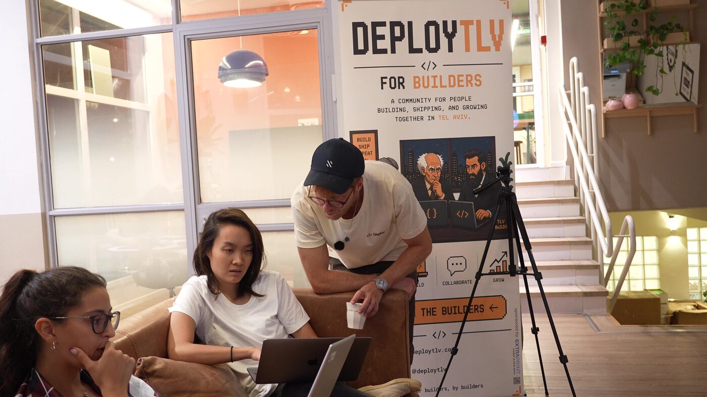 Helping a student next to the Deploy banner